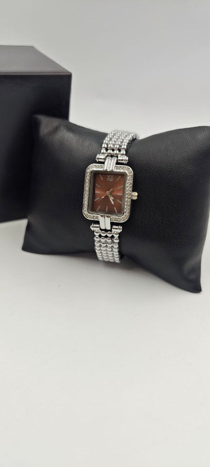 GÜMÜŞ RENK İÇİ TURUNCU BAYAN SAATİ